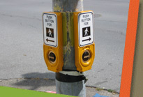 Walk signal on light post
