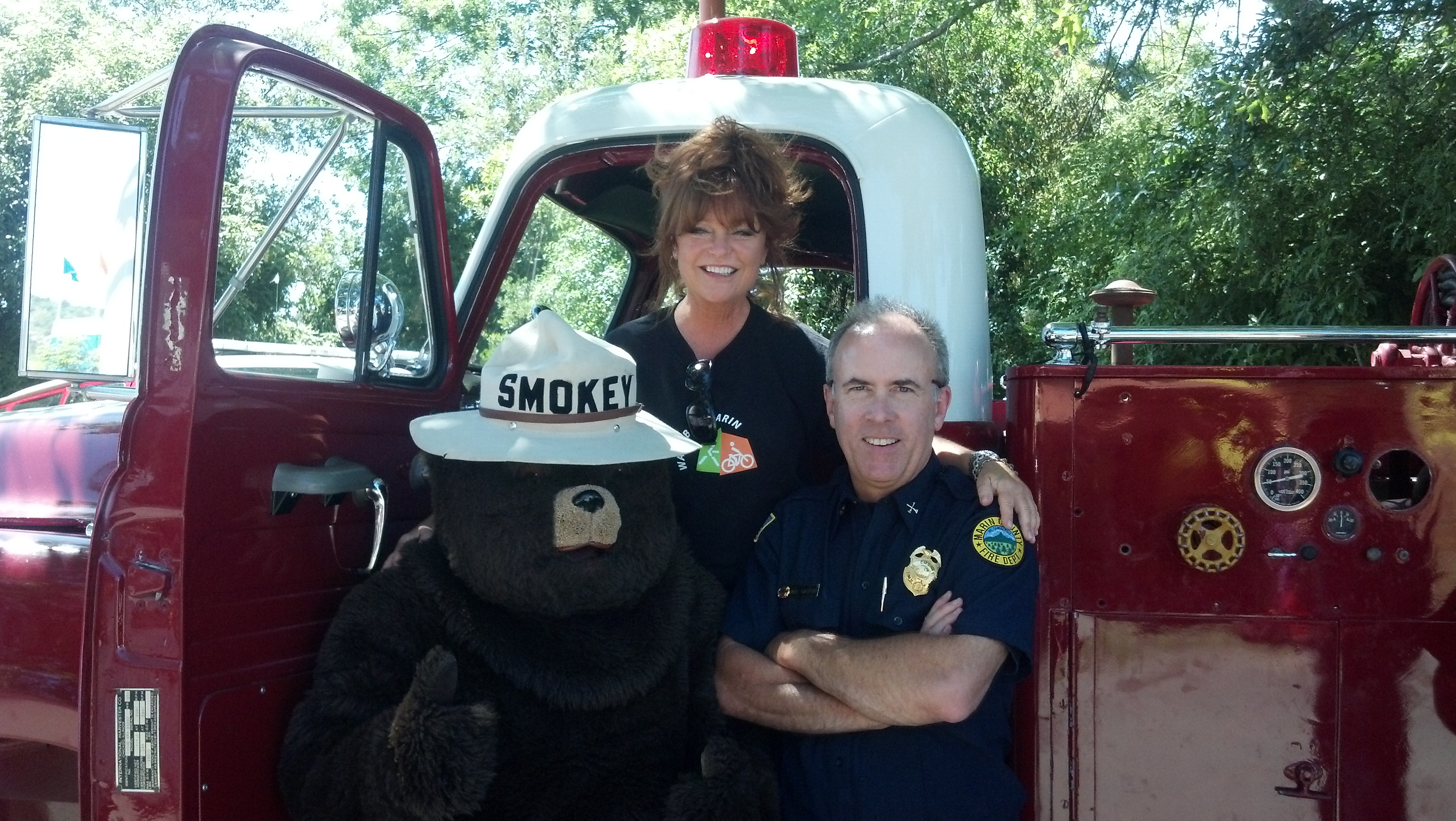 WBM Staffer JeriLynne Stewart, Marin County Fire Department Emergency Medical Officer, and Smokey the Bear enjoying the fair!